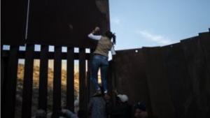 Migrants jump border fence in Tijuana to take a look at to reach US