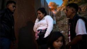 Migrants jump border fence in Tijuana to take a look at to reach US