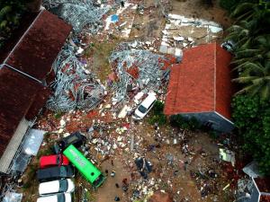no less than 168 lifeless in Indonesian tsunami which slammed into beaches unexpectedly