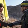 North and South Korea infantrymen pass DMZ in peace